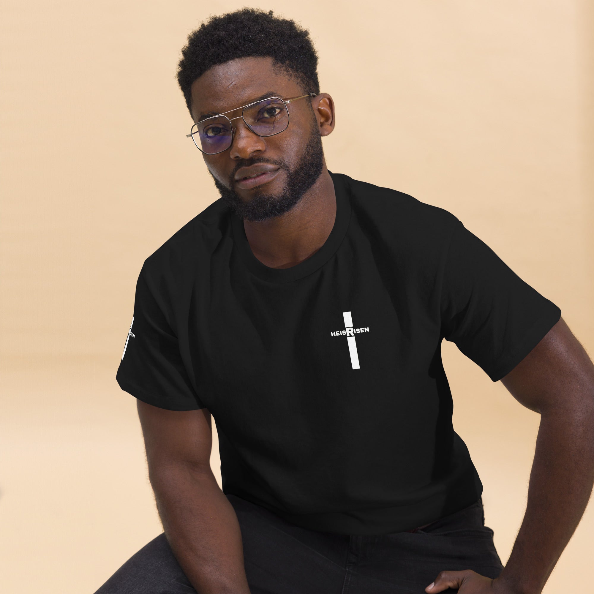 Black Christian resurrection T‑shirt with HE IS RISEN design inspired by 1 Peter 1:3.
