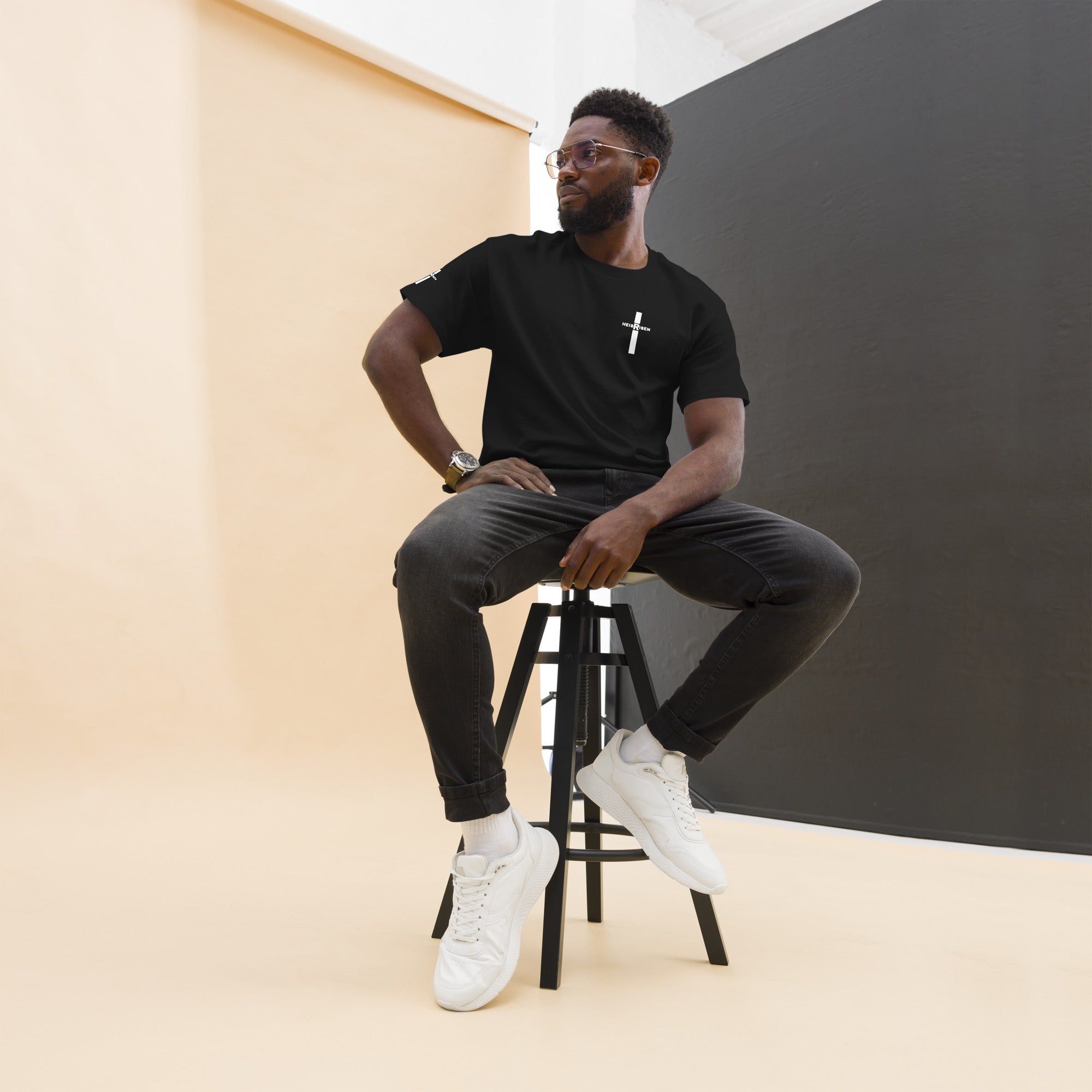Black Christian resurrection T‑shirt with HE IS RISEN design inspired by 1 Peter 1:3.