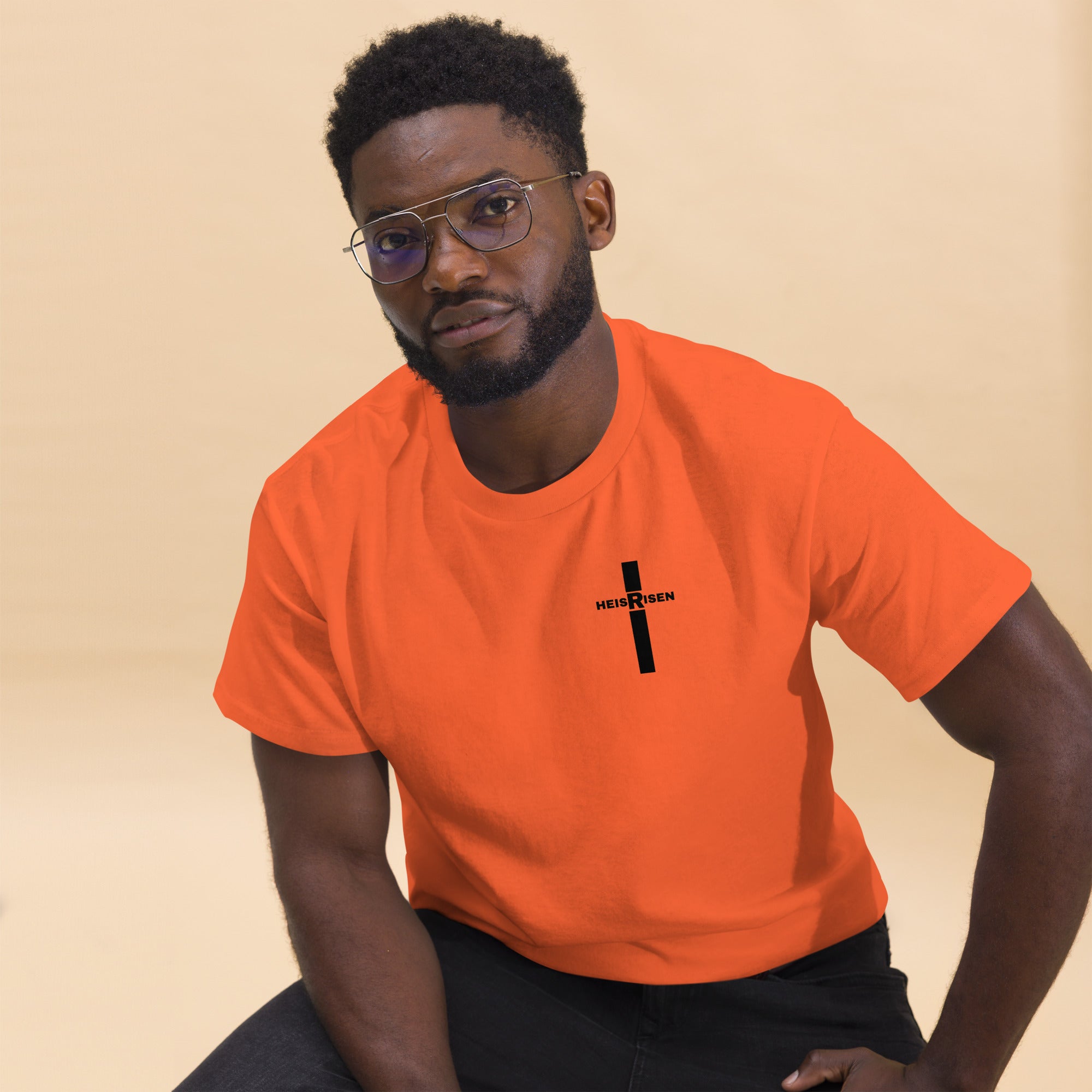 DKINGDOMFASHIONS red HE IS RISEN shirt declaring the resurrection.