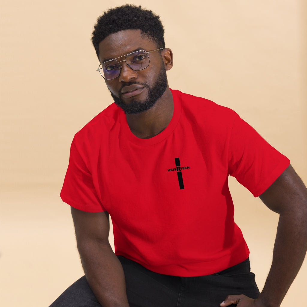 Red Christian resurrection T‑shirt with HE IS RISEN design inspired by 1 Peter 1:3.