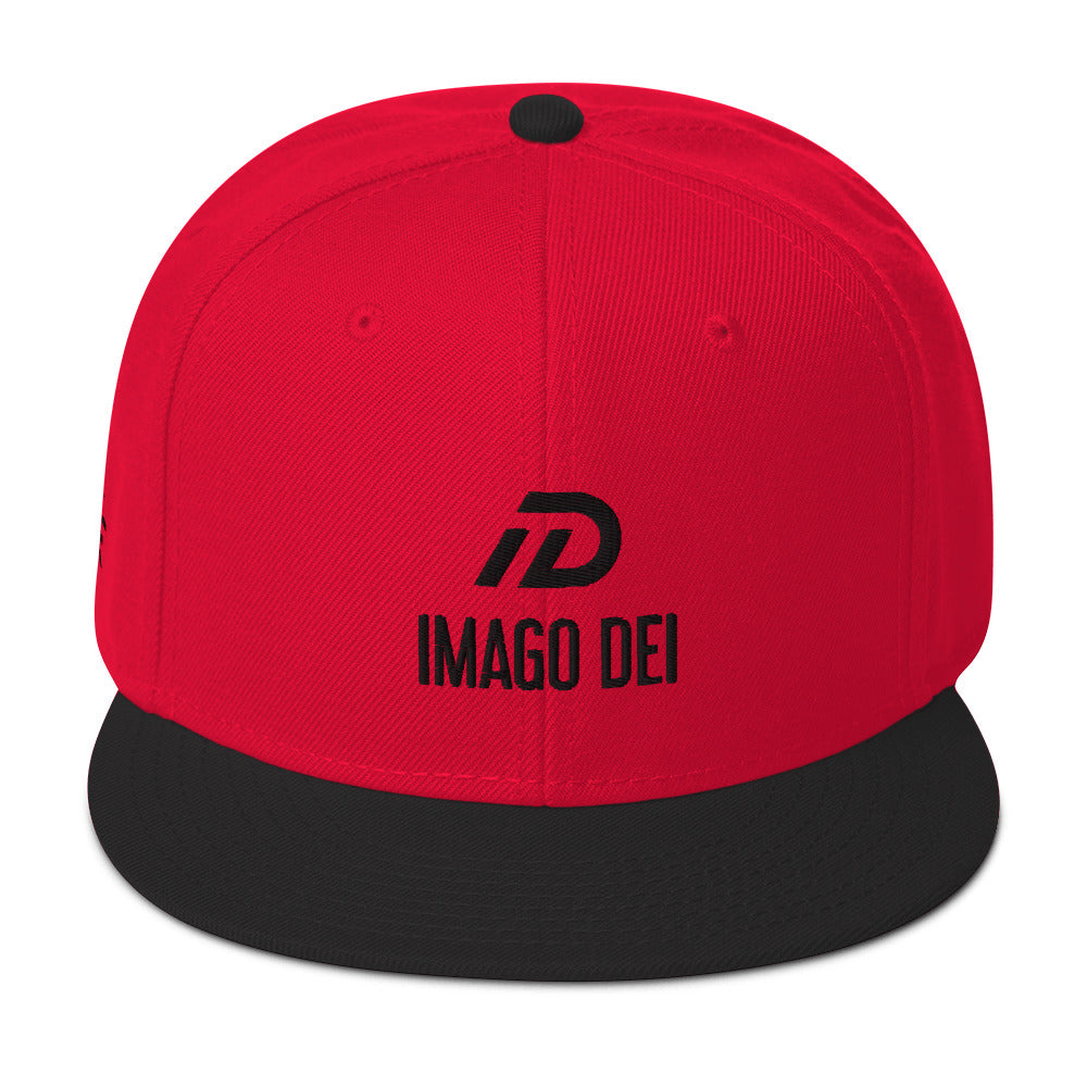 Black and red IMAGO DEI snapback hat with red embroidery — Christian streetwear.